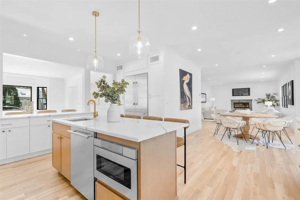 Kitchen island with microwave drawer and open dining area