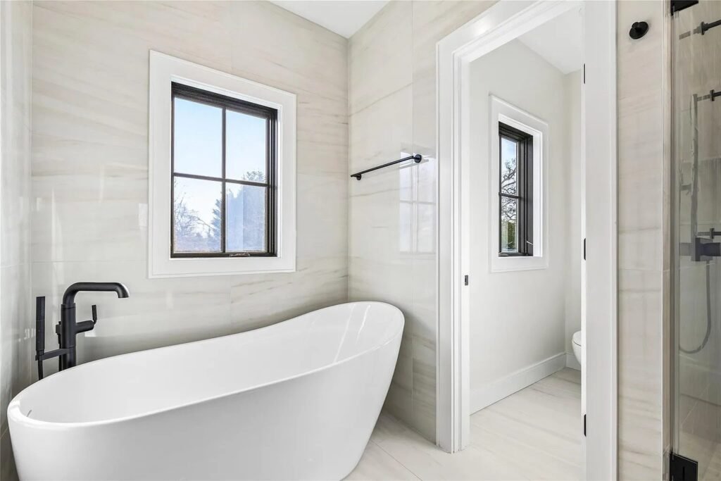 Bathroom with freestanding tub and black fixtures