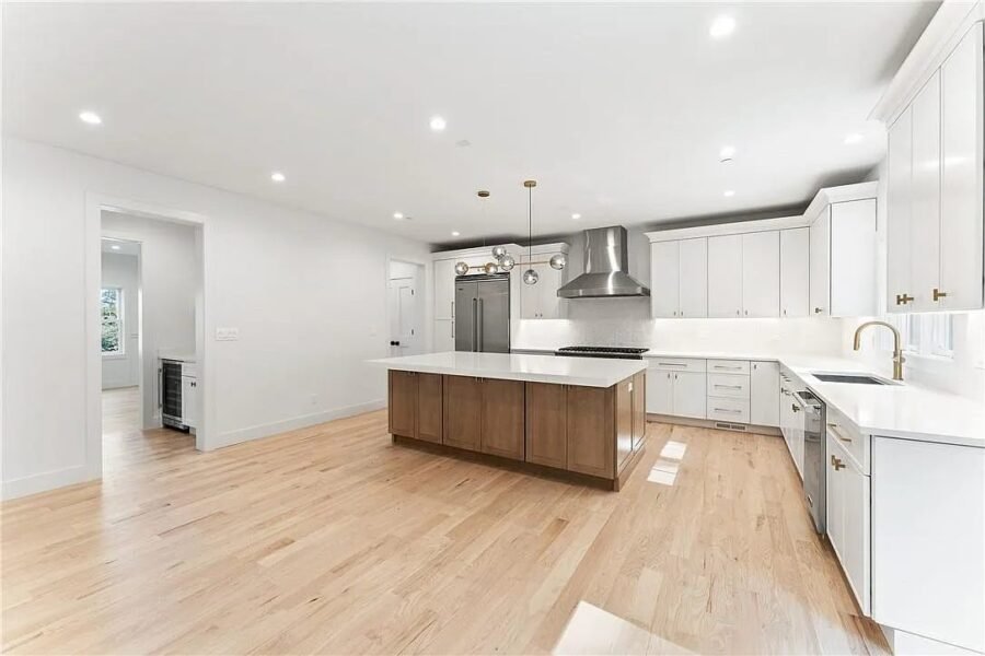 Kitchen with walnut island and white cabinets