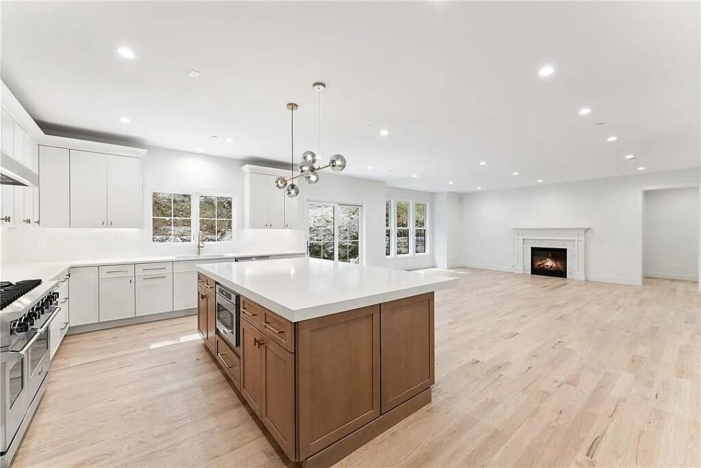 Open kitchen and living room with fireplace