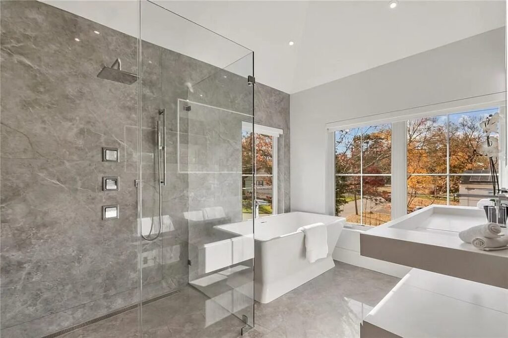 Spa bathroom with freestanding tub and glass shower