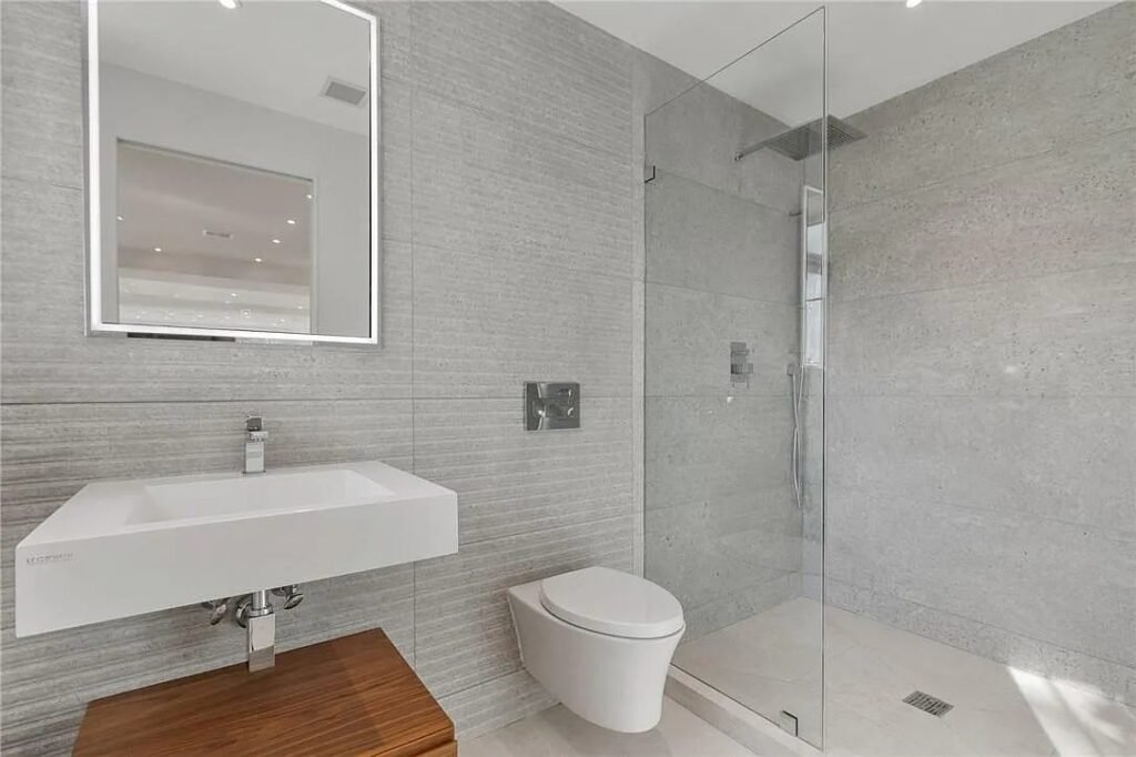 Bathroom with floating vanity and frameless glass shower
