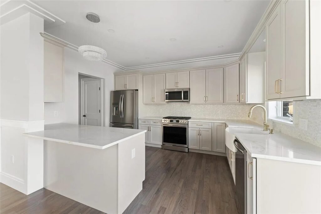 Kitchen with island and stainless appliances